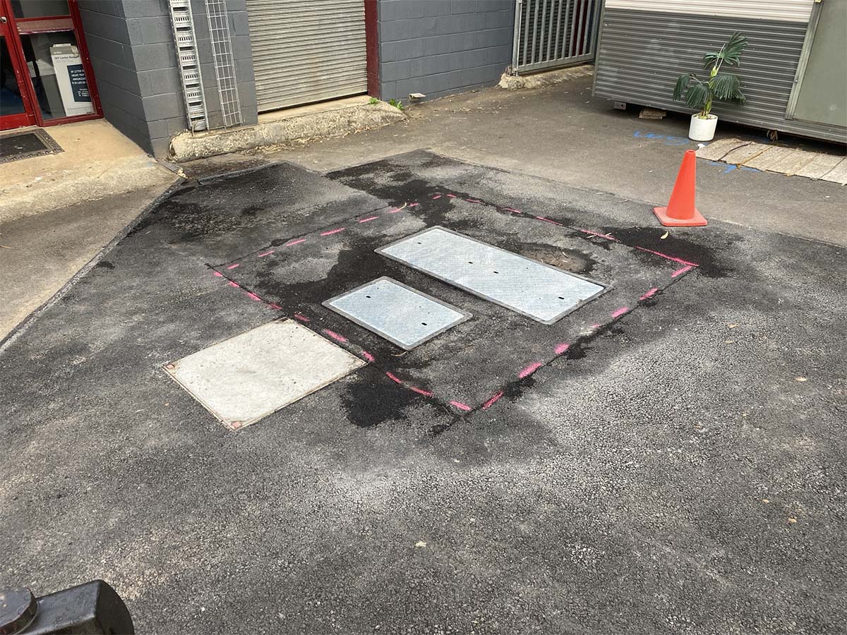 Before image of an Asphalt Patch Repair for RM Civil in Blairmount, New South Wales
