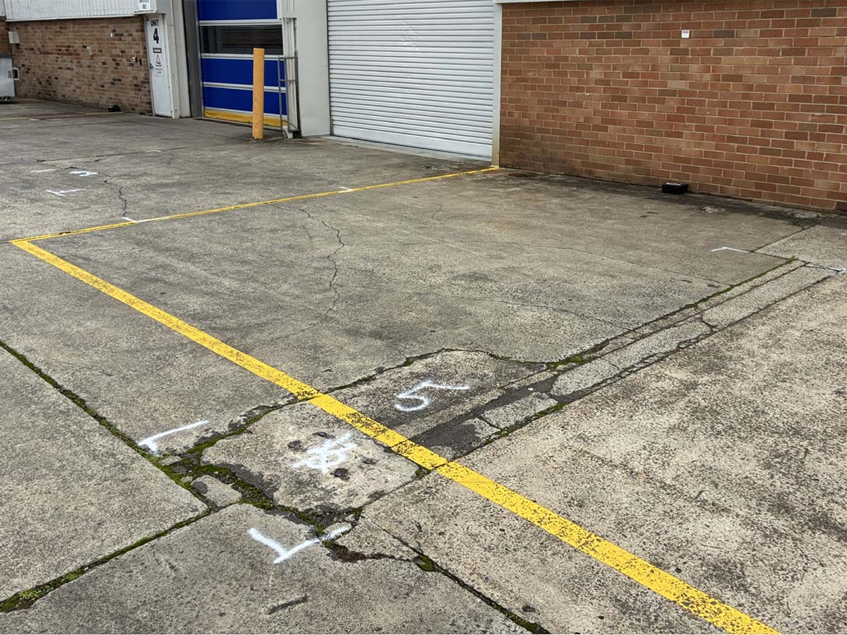 Before image of an Asphalt Patch Repair for IB Property in Kingsgrove, New South Wales