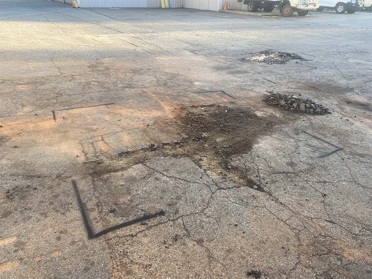 Before image of an asphalt patch repair in Welshpool, Western Australia for Big Yellow Mining Pty Ltd.