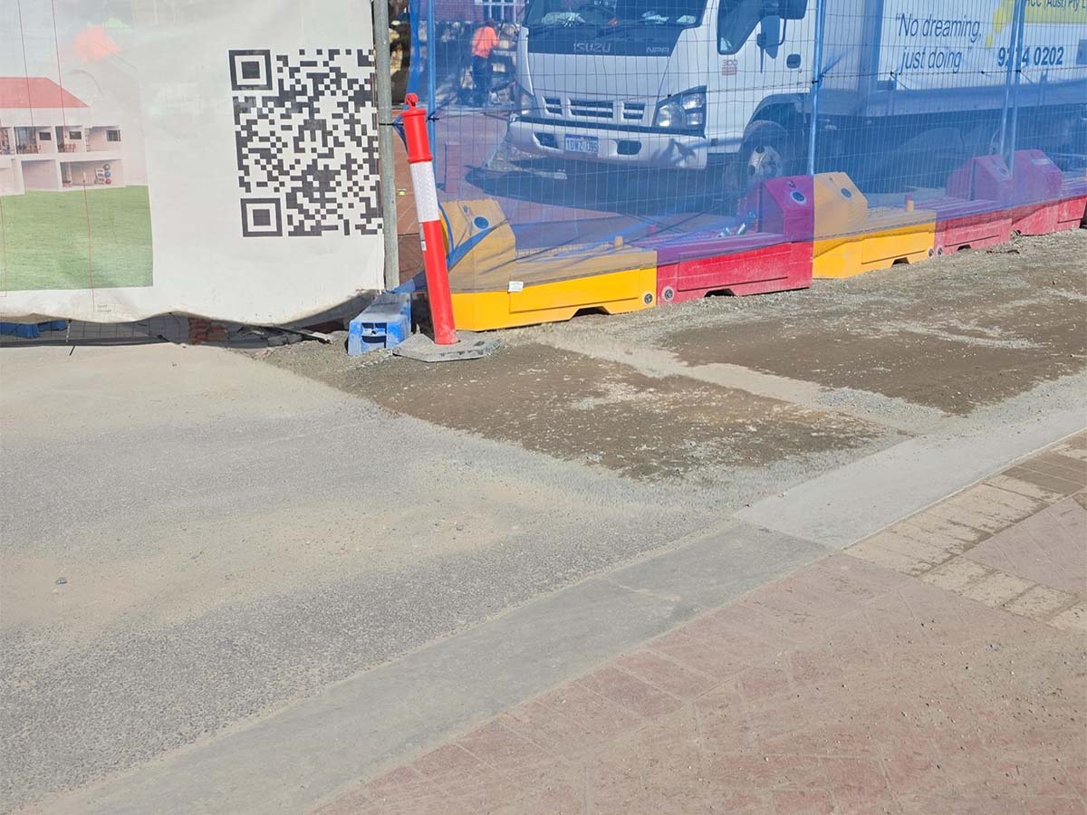 Before image of an asphalt patch repair in South Perth, Western Australia for Hugh & Co Contracting.